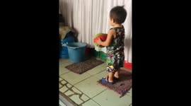 Khalib 2years old and he is learning to shot the ball in a bucket.