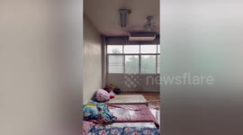 Classroom ceiling leaks during heavy summer storm in Thailand