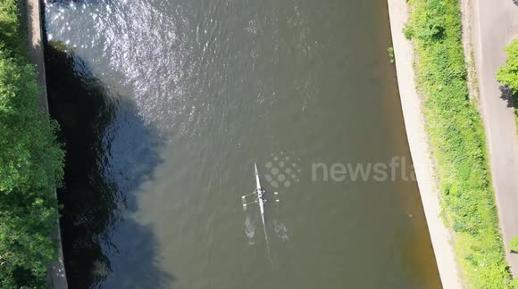 Rowers on the River Ouse in York, enjoying the hot day on the water