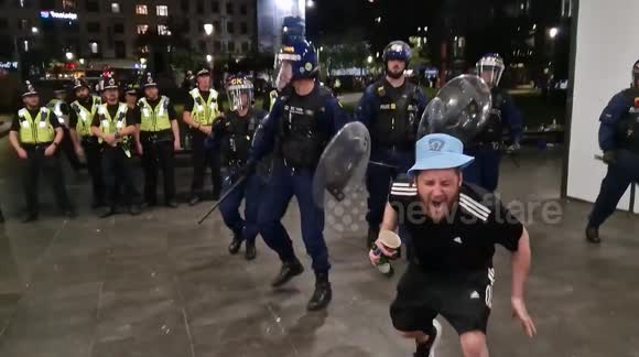Police officer strikes Man City fan with baton after celebrations turn sour