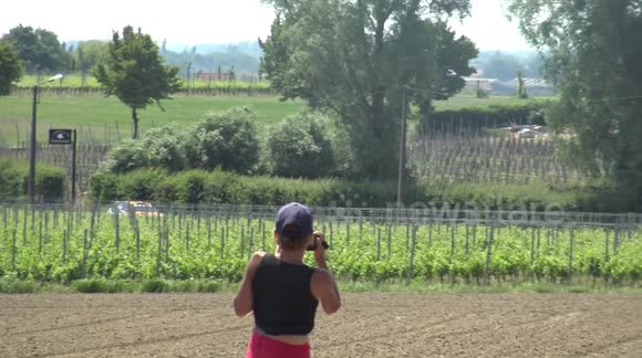 The Danger of Rally. Spectator crosses leisurely, spectators shout