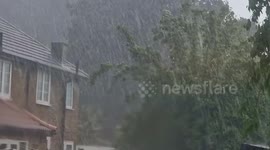 Heavy storm breaks in south-west London bringing torrential rain and HAIL
