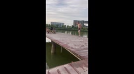 Chinese Man's Perfect Dive into Floating Mini Yellow Swim Ring