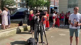Bereaved family members gather outside Covid-19 Inquiry Hearing Centre