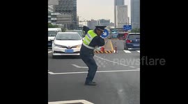 Traffic police's hilarious dance moves bring delight to streets in China