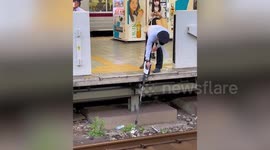 Kind security guard retrieves Airpod from subway railway tracks