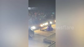 Energetic dancer cartwheels across stage and lands on split during Bangkok show