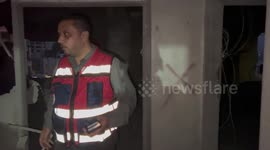 People inspect the damage at the house of Palestinian Osama Tawil, who was arrested on February 13 and charged with killing a soldier, in the West Bank city of Nablus