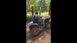 Man Driving Quad Dirt Bike crashes it backwards trying to climb a steep path