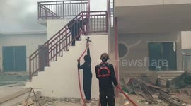 Firefighters tackle raging forest fire 'caused by agricultural burning' near Thai village