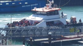 Border force  vessel Typhoon returns to Dover with young children, women and men