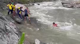 Rescuers defy strong river current to bring 18-year-olds to safety in India