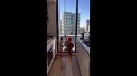 Window Washer Delights With Superhero Mask