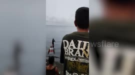 Fishermen rescue 7ft sunfish stranded in shallow waters off the coast of the Philippines