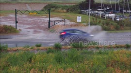 Motorists contend with heavy rain during a thunderstorm in Kent, UK