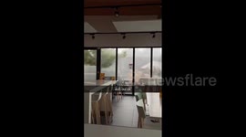 Violent gusts of wind hit window during powerful storm in France