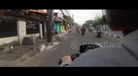 riding a motorcycle on the street
