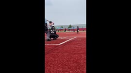 Girl tired of mom recording her play breaks her phone by fouling off ball in her direction