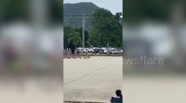 Stray dog gatecrashes military school parade and leads them in march