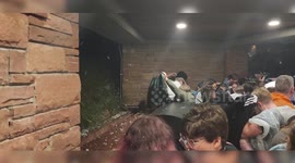 Moment Louis Tomlinson fans took cover from huge hailstones during gig