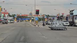 Alien spaceship vehicle amuses motorists as it crosses junction in Thailand
