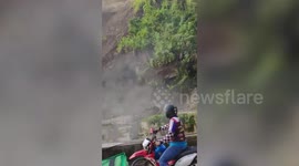 Landslide crashes onto road as terrified motorists watch