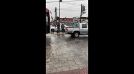 Pickup Truck Lets Teachers Cross Over Puddle