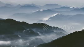 Stunning ink-painting view of E China's Longmian Mountain after rain