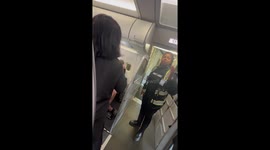 A lady runs on board a plane after. Being denied seats and leaves her children at the gate be in bang watches by her other cell phone