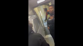 A lady runs on board a plane after. Being denied seats and leaves her children at the gate be in being watched by her other cell phone