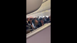 A lady runs on board a plane after. Being denied seats and leaves her children at the gate be in being watched by her other cell phone