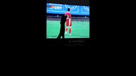 Wow! Is this cat mistaking football players for mice running across the TV screen? It is trying to pounce on football players!