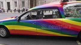 A funeral hearse with pride colour's parks up at Whitehall during the 2023 London Pride parade