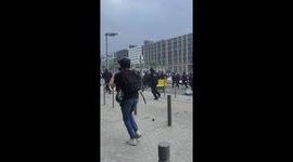 A company of police charges against demonstrators during violent clashes in Nanterre (France).