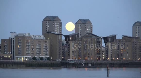 Pretty scene as Buck Moon ascends above London Docklands