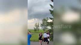 Huge tornado interrupts golf game near Carstairs, Canada