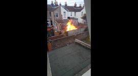 Neighbour's late evening bonfire in the terraced house garden