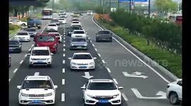Car gets trapped in double lane-switch in China