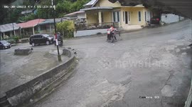 Dozens of motorcycles slip and crash on Indonesian road due to diesel spill, one rider breaks bone