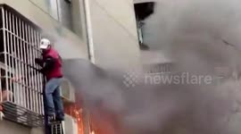 Ex-cop delivery driver saves woman from China blaze