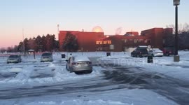 Ice sculpture in the shape of a car left behind after parked car moves