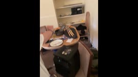 Woman stunned during house viewing as man is asleep on sofa surrounded by booze