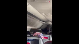 Super compassionate flight attendant helps calm passenger's baby down mid-flight