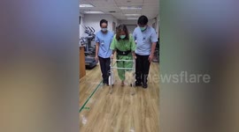 Passenger, 57, whose leg was amputated by faulty airport travelator takes first steps following horror accident