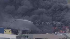 Firefighters battle colossal blaze at Swiss industrial park