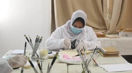 Palestinian researchers repair and and archive the books and ancient manuscripts in Gaza City