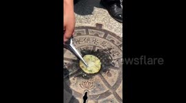 Chinese man cooks pancakes on scorching manhole cover amidst sweltering 40 degrees Celsius heatwave