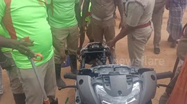 A snake coiled inside a new vehicle that was brought for registration in India. Fire staff dismantled the vehicle and caught the snake.