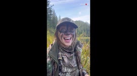 Wildlife videographer captures a grizzly bear playing with broken tree branch