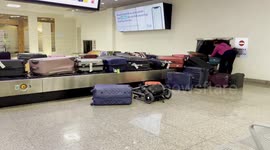 Luggage reclaim at Malta Airport becomes overloaded and throws bags off belt